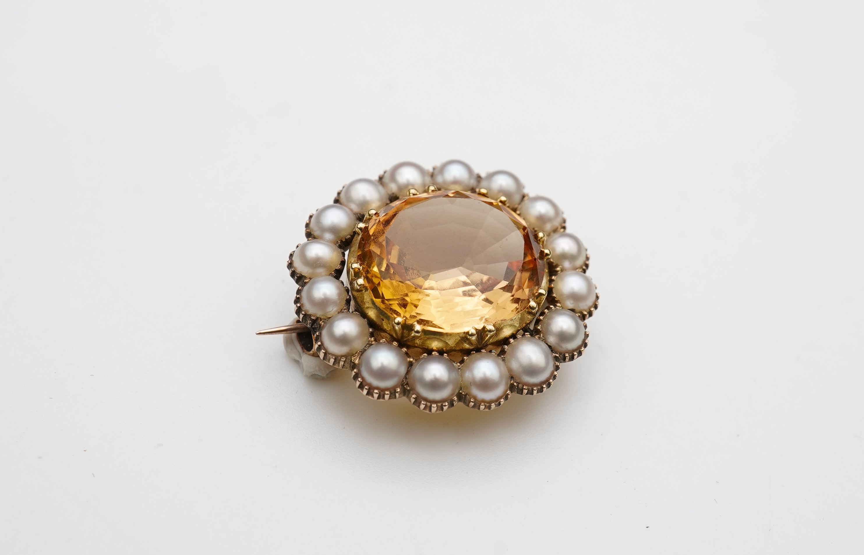 A Victorian topaz and pearl brooch, late 19th century